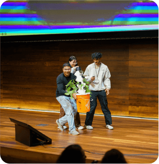 demoer hudzah presenting his vertical farm on stage at symposium photo