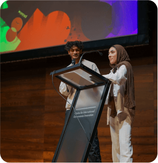 symposium hosts hudzah and inyah on stage photo